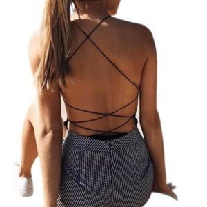 Black bodysuit with crisscross back.